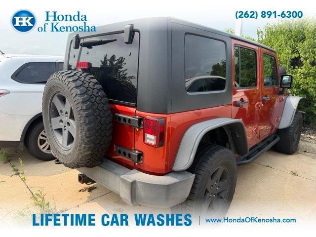 Used 2009 Sunburst Orange Pearl Jeep Unlimited X image 2