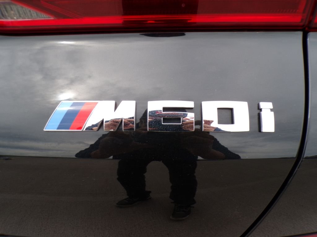 Certified Used 2024 Black Sapphire Metallic BMW M60i image 27