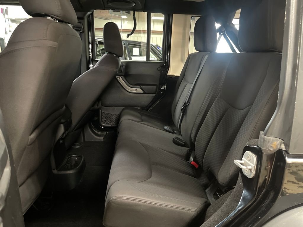 Used 2013 Black Jeep Unlimited Sport image 21