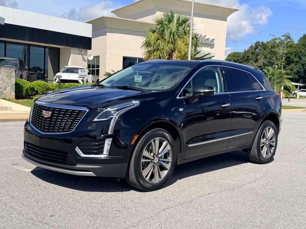 Used 2021 STELLAR BLACK METALLIC Cadillac FWD Premium Luxury image 1