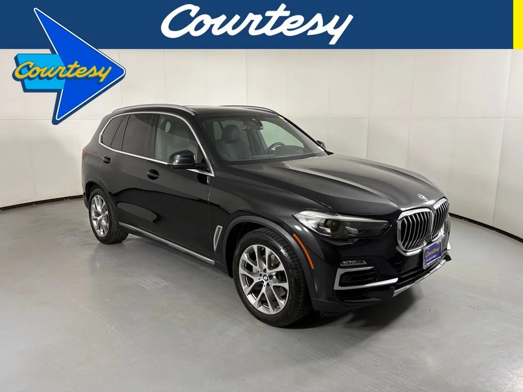 Used 2020 Black Sapphire Metallic BMW sDrive40i image 1