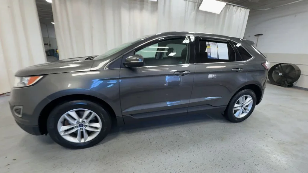 Used 2015 Magnetic Metallic Ford SEL image 6