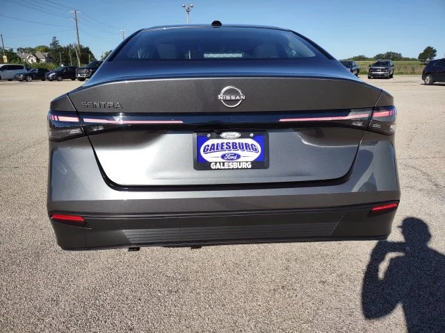 Used 2027 Gun Metallic Nissan SV image 4