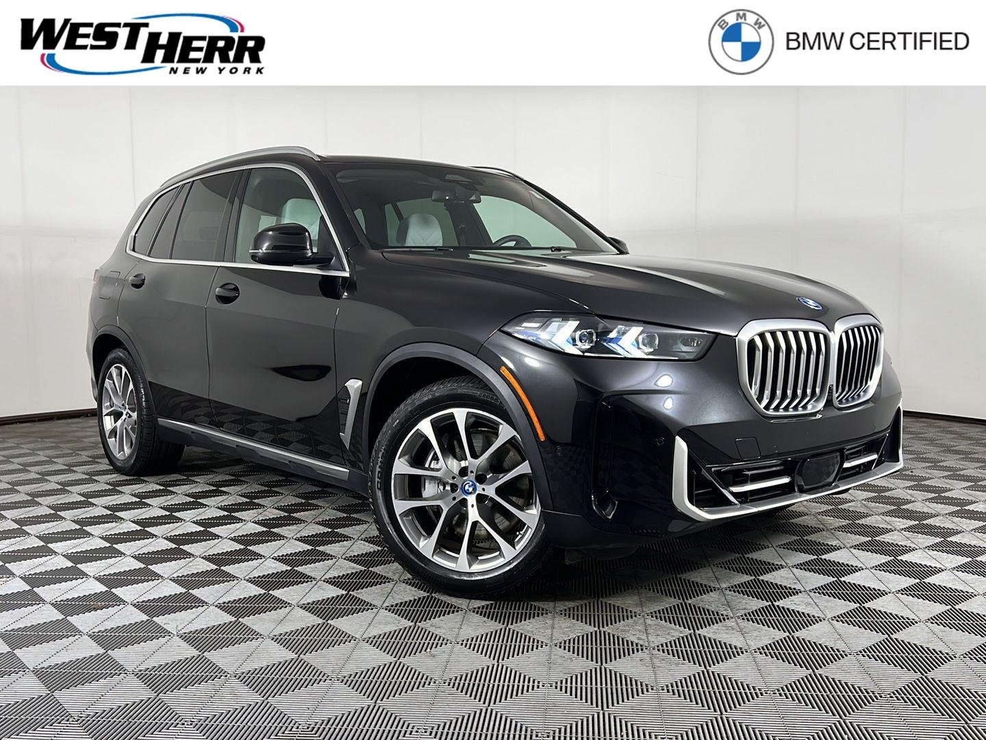Certified Used 2024 Black Sapphire Metallic BMW xDrive50e image 1