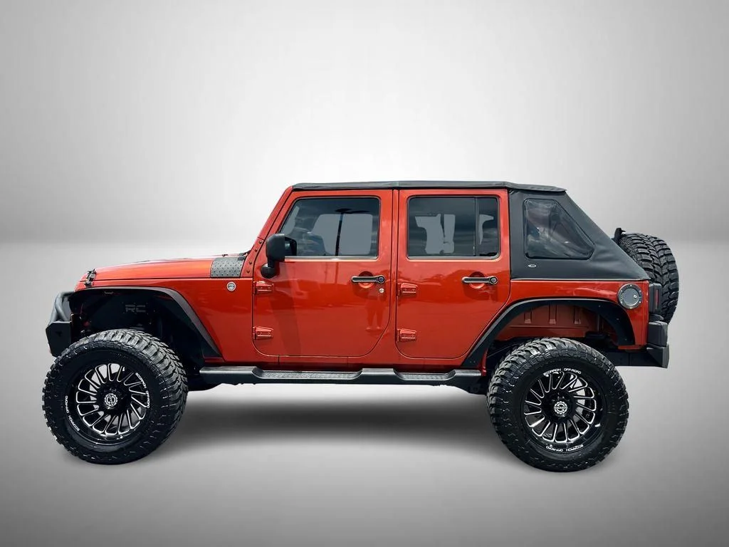 Used 2009 Orange Jeep Unlimited X image 6
