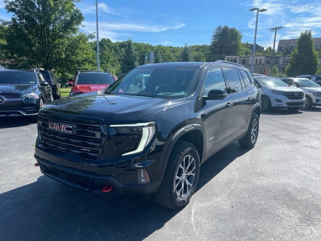 Used 2024 Ebony Twilight Metallic GMC AT4 image 1