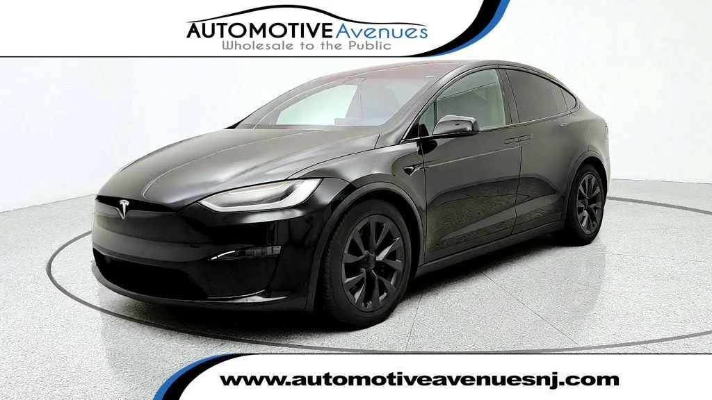 Used 2023 Solid Black Tesla AWD image 1