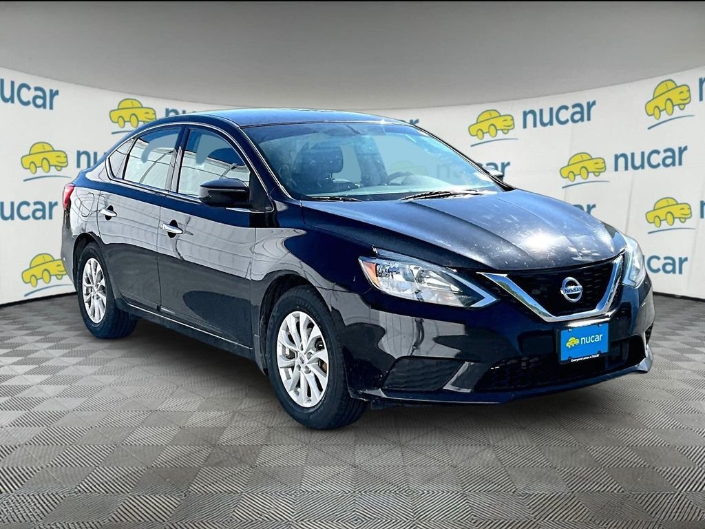 Used 2019 Super Black Nissan SV image 1
