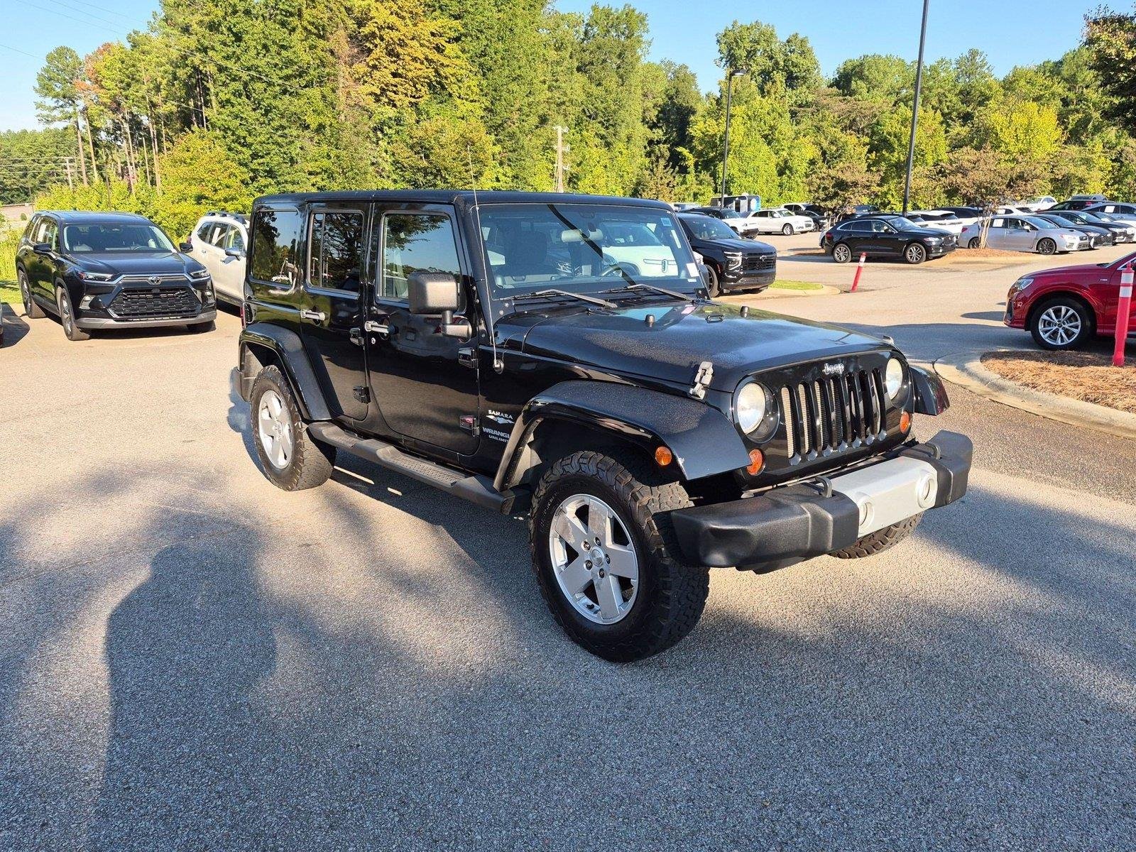 Used 2011 Black Clear Coat Jeep Sahara image 6