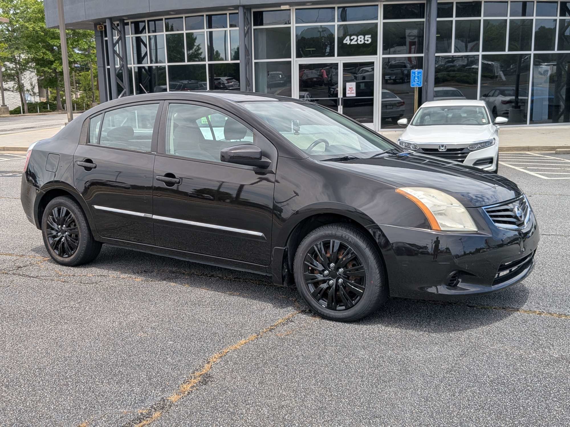 Used 2010 Black Nissan 2.0 S image 1