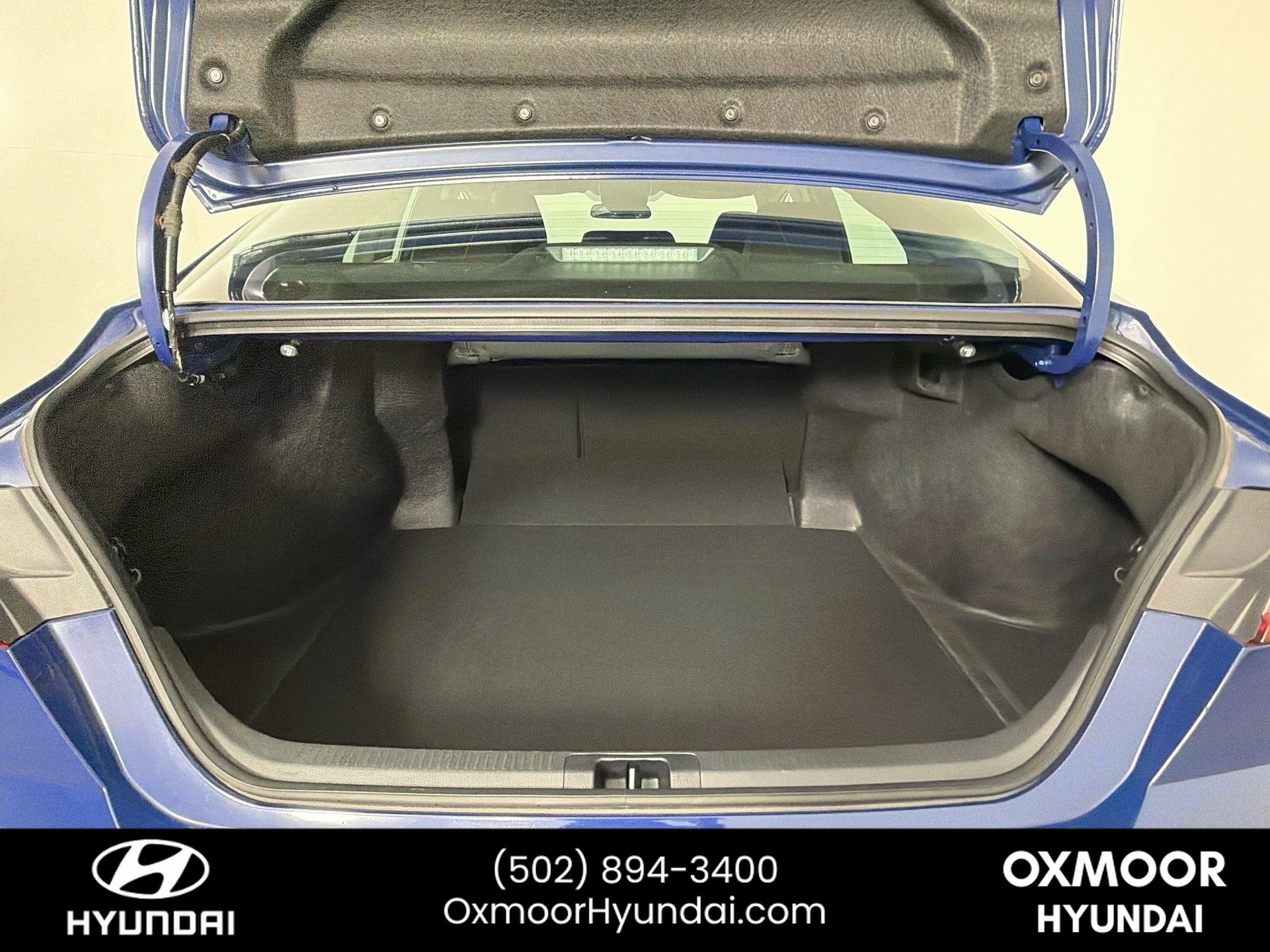 Used 2025 Reservoir Blue Toyota LE image 25