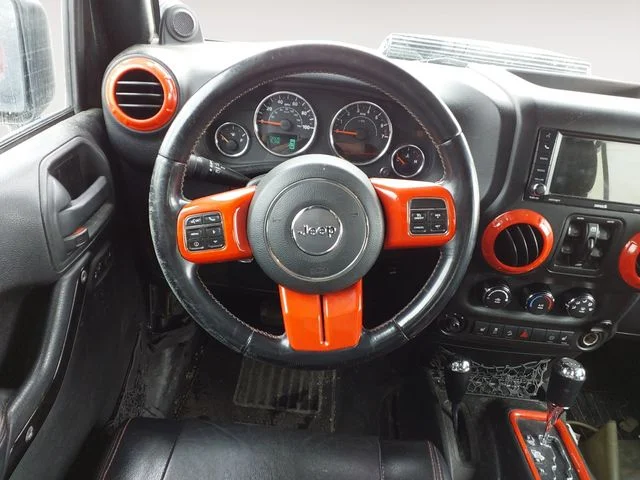Used 2012 Black Jeep Unlimited Sahara Altitude image 12