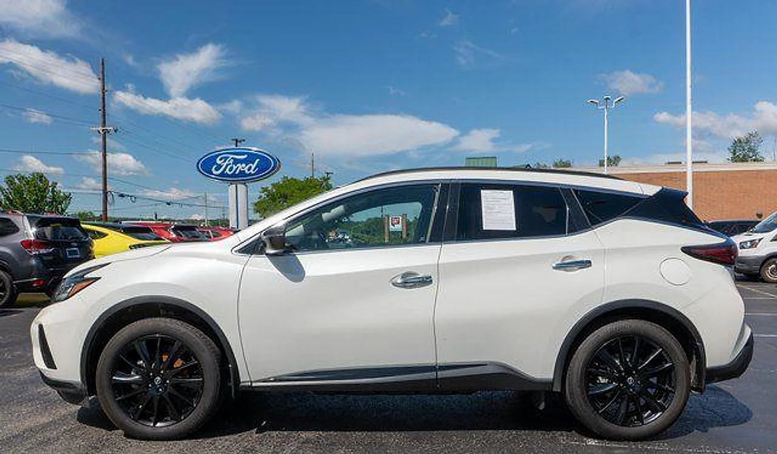 Used 2024 Pearl White Tri Nissan SV image 9