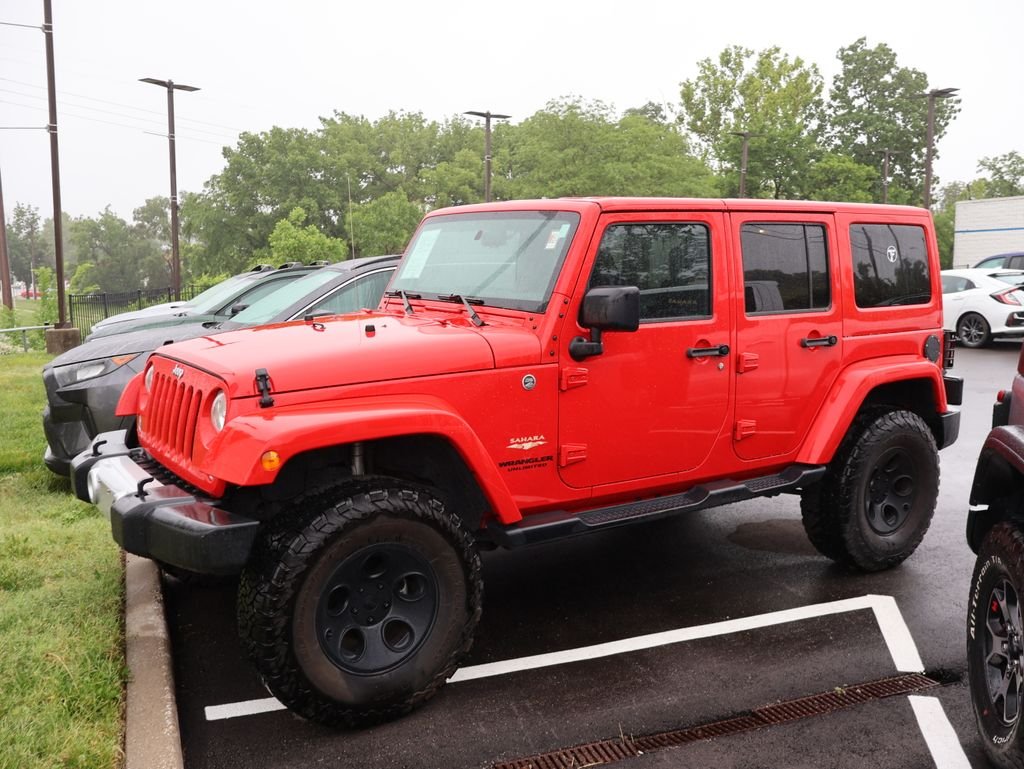 Used 2015 Red Jeep Unlimited Sahara image 4