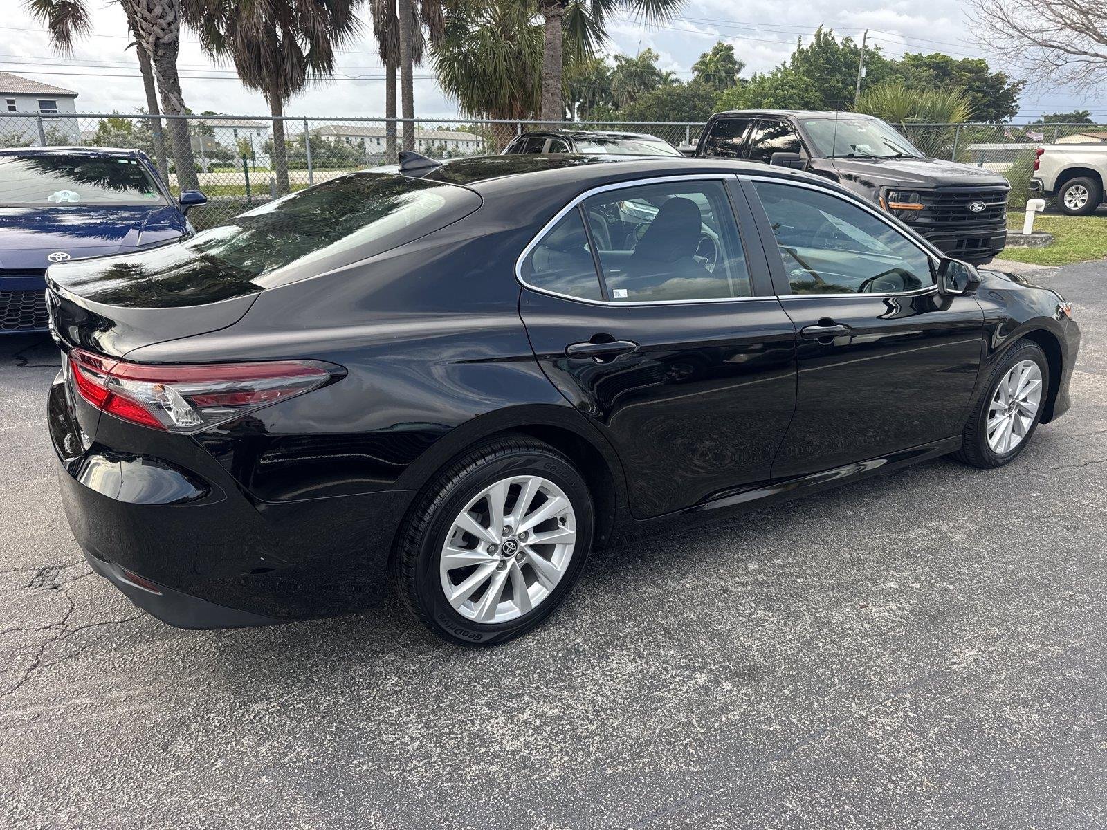 Used 2024 Midnight Black Metallic Toyota LE image 4