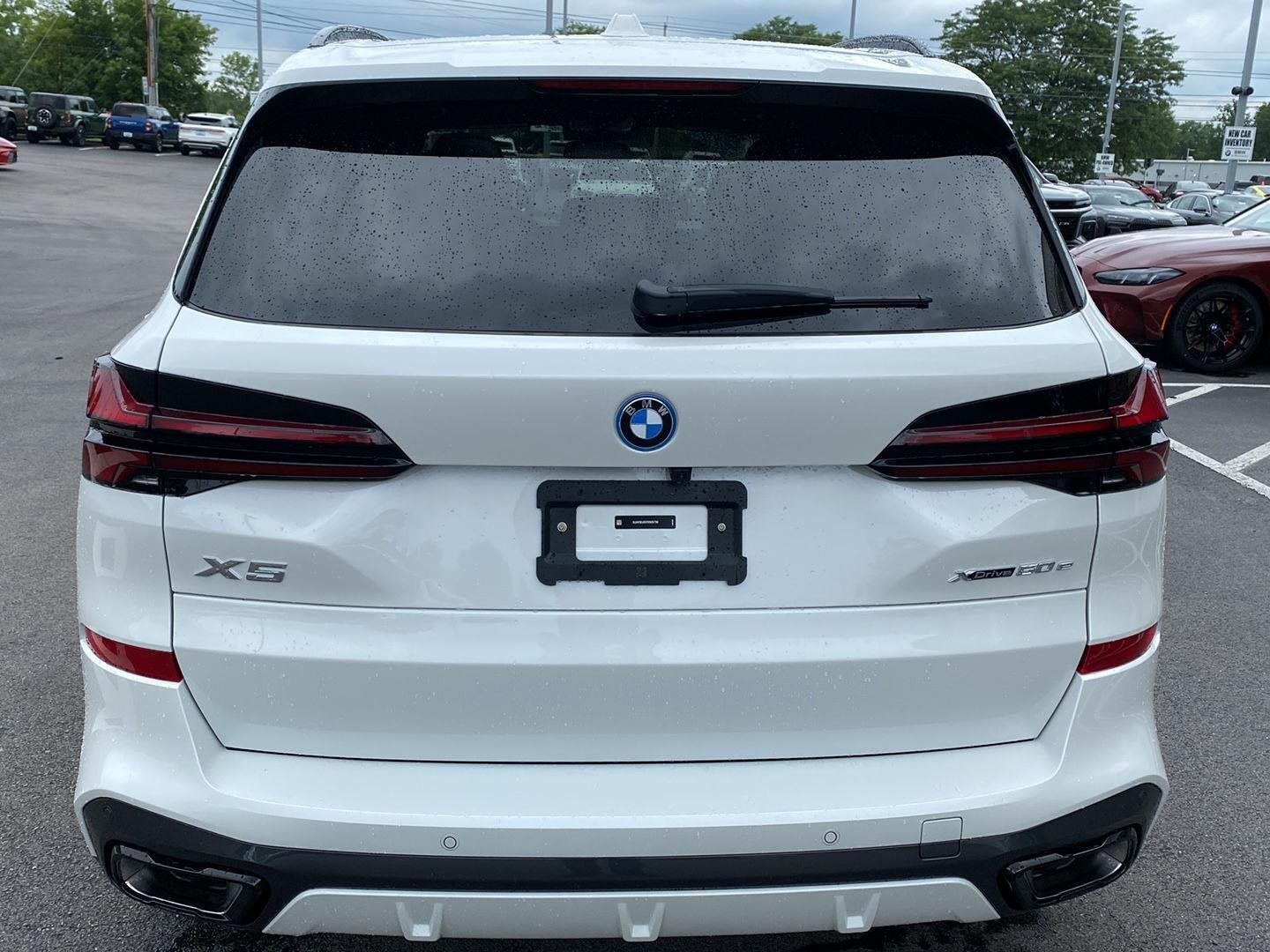 Used 2026 Mineral White Metallic BMW xDrive50e image 3