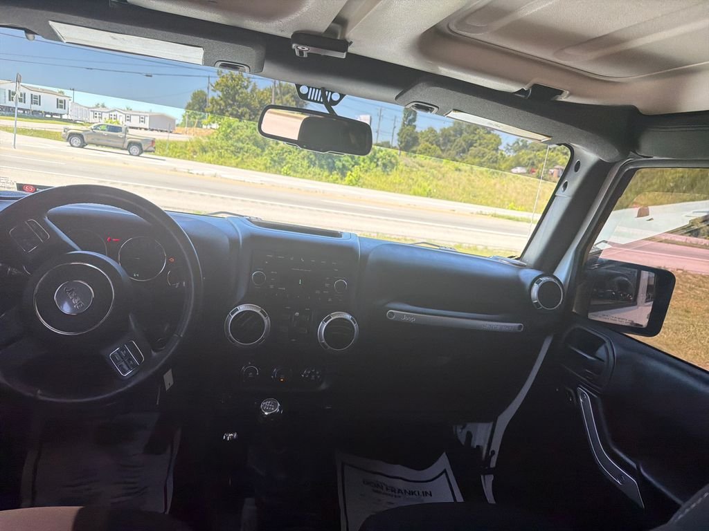 Used 2016 White Jeep Unlimited Sahara image 12