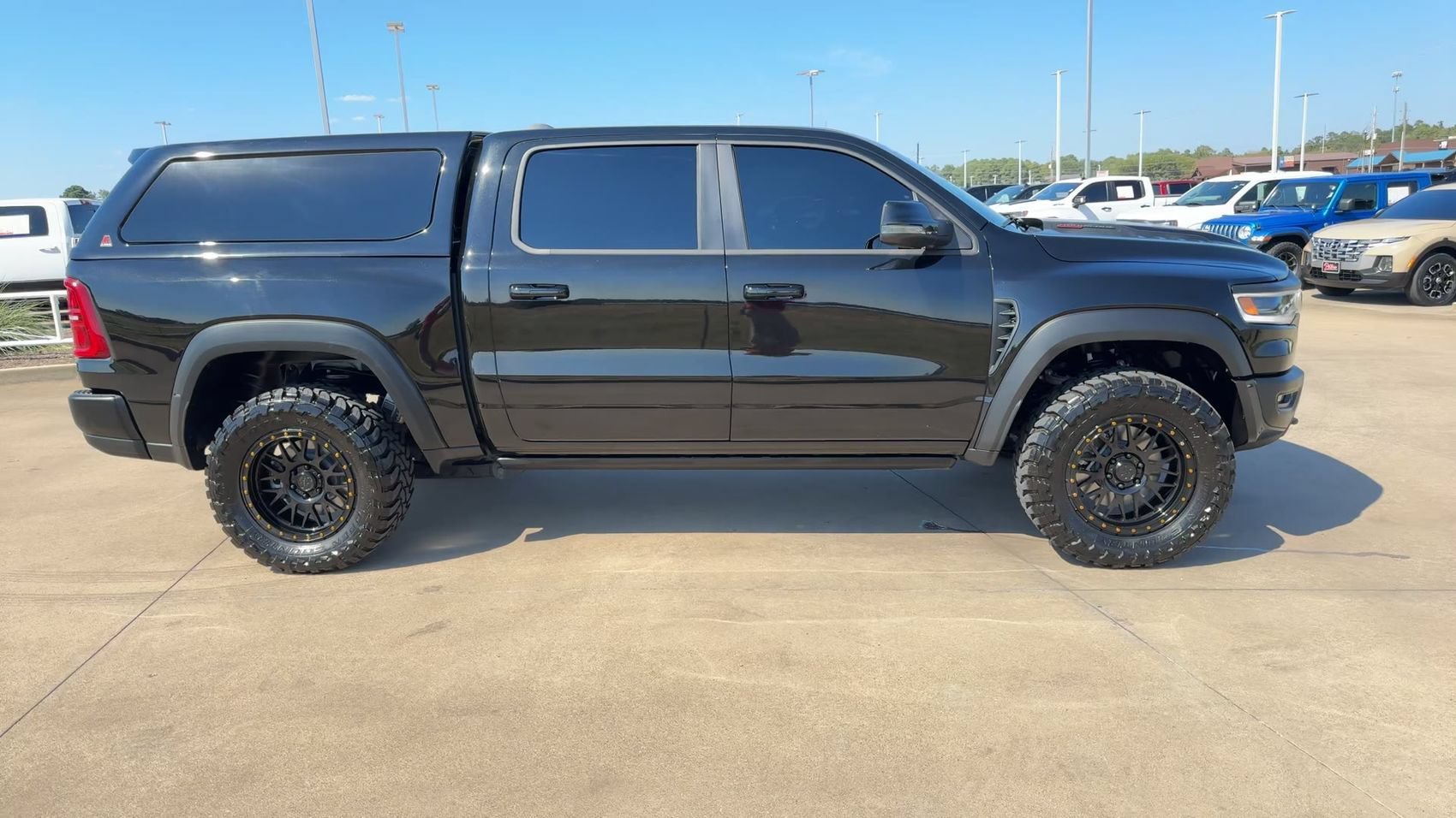 Used 2025 Diamond Black Crystal Pearlcoat Ram RHO image 2