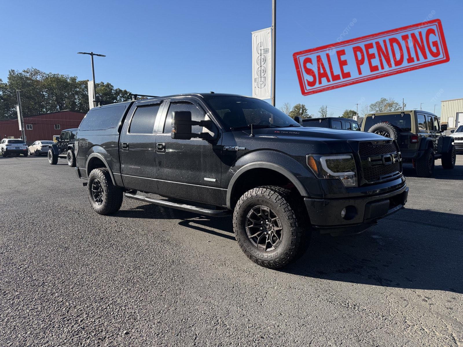 Used 2013 Tuxedo Black Metallic Ford FX4 image 1