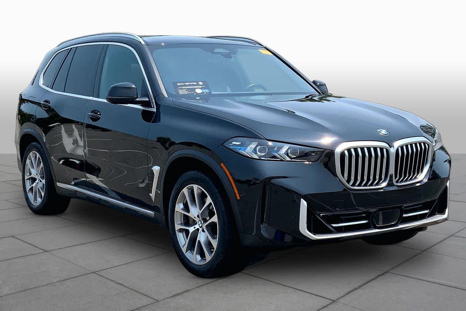 Certified Used 2024 Black Sapphire Metallic BMW xDrive40i image 2
