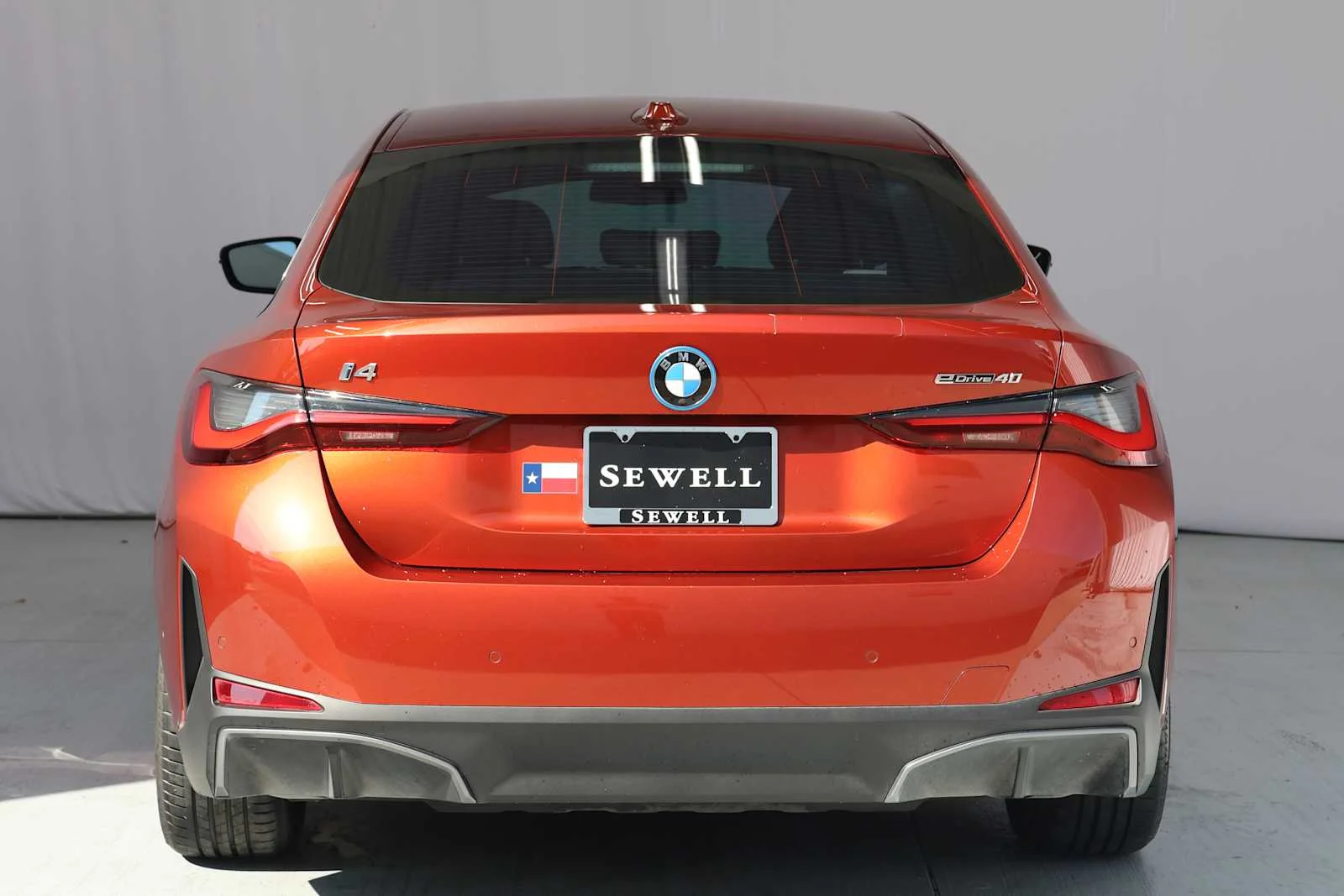 Certified Used 2023 Sunset Orange Metallic BMW eDrive40 image 5