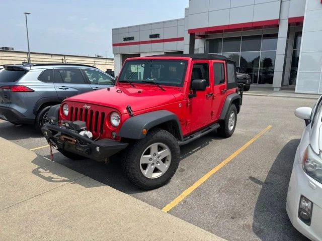 Used 2018 Red Jeep Unlimited Sport image 1