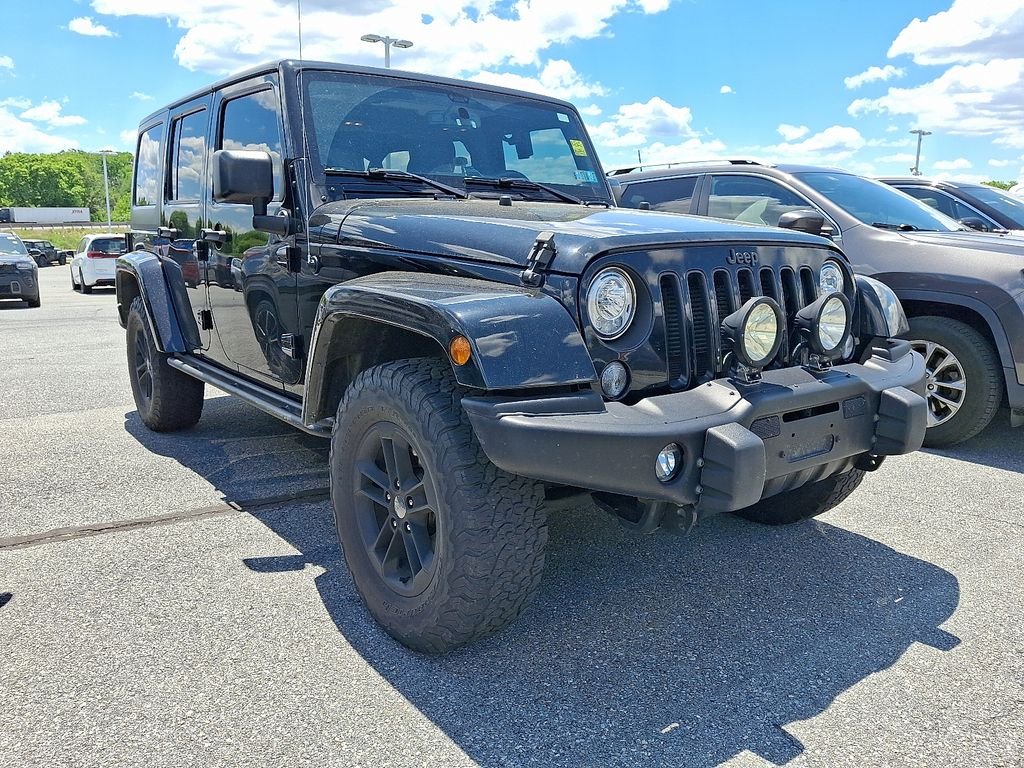 Used 2017 Black Jeep Unlimited Sahara image 1