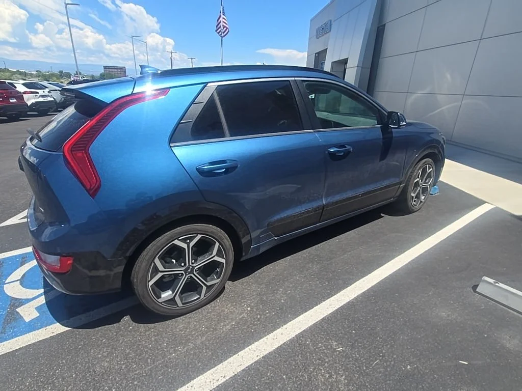 Used 2023 Mineral Blue Kia EX Touring image 6
