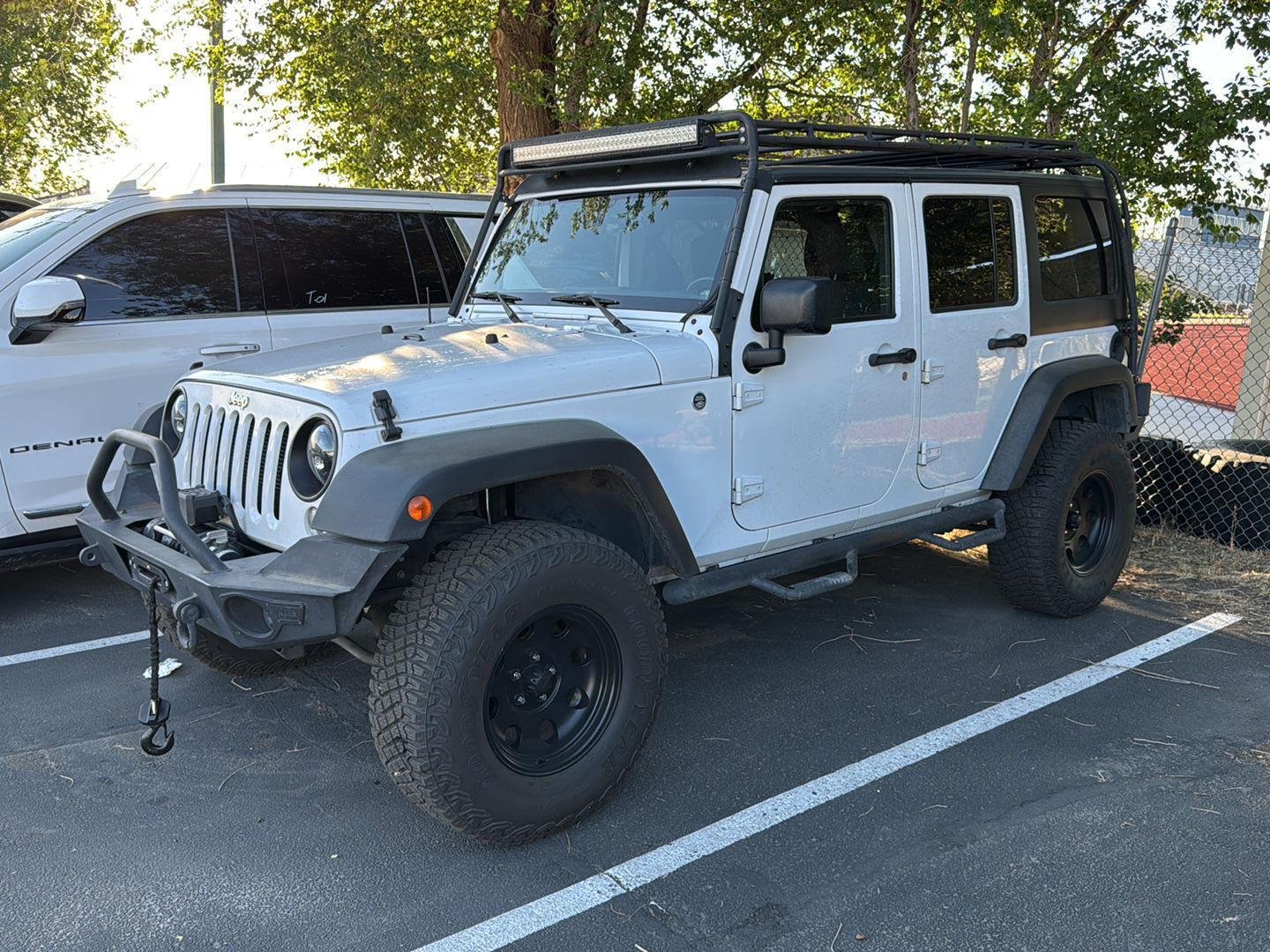 Used 2015 Jeep Wrangler Unlimited Sport with VIN 1C4BJWDG5FL551256 for sale in Woods Cross, UT