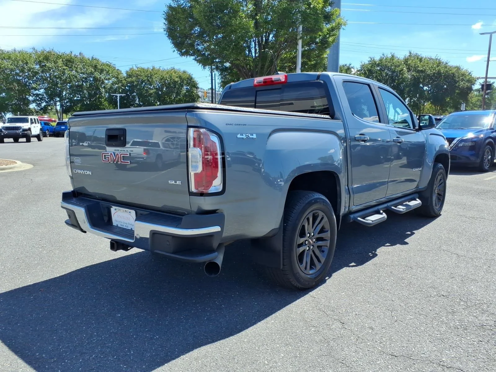Used 2019 Quicksilver Metallic GMC 4WD SLE image 2