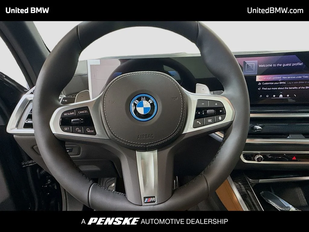 New 2026 Black Sapphire Metallic BMW xDrive50e image 6