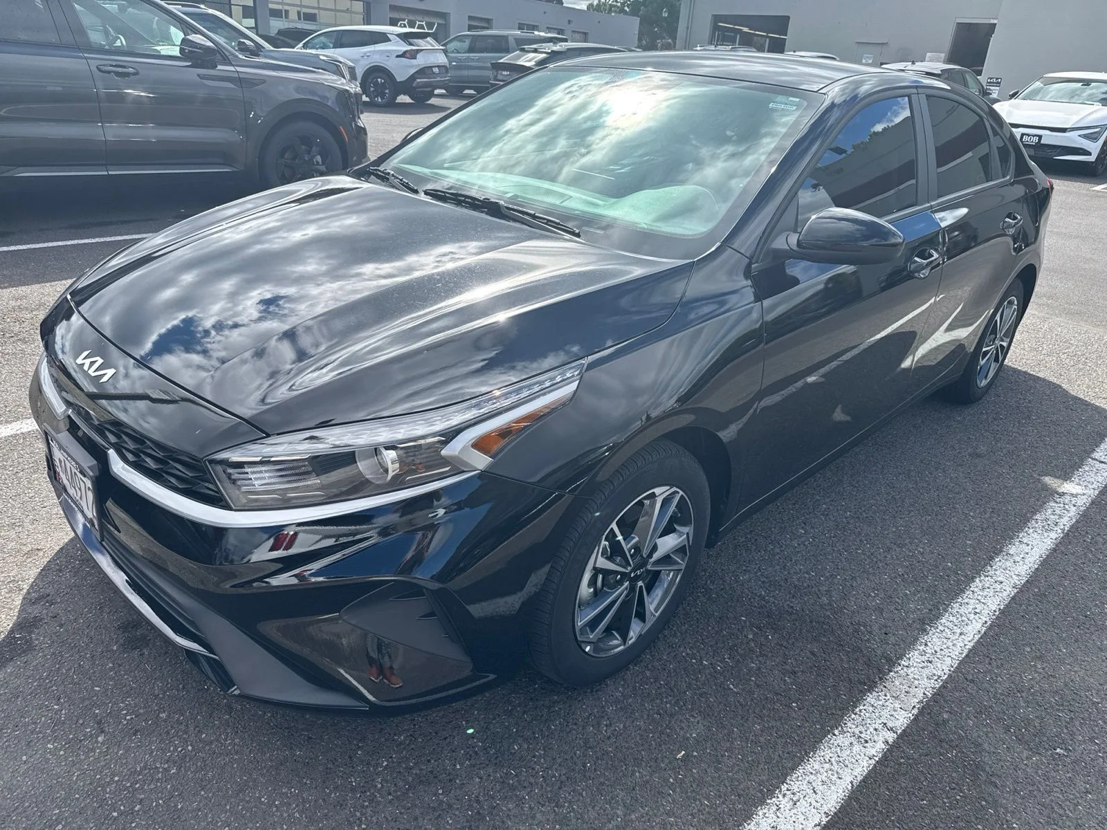 Used 2024 Aurora Black Kia LXS image 1