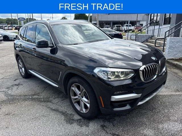 Used 2021 Black Sapphire Metallic BMW sDrive30i image 1
