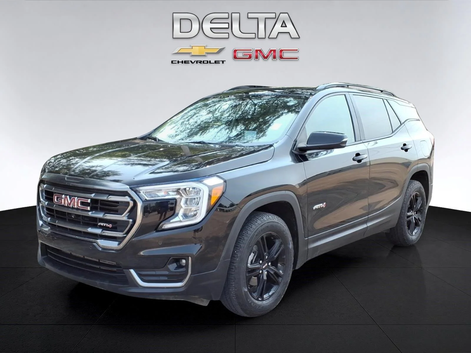 Used 2024 Ebony Twilight Metallic GMC AT4 image 10