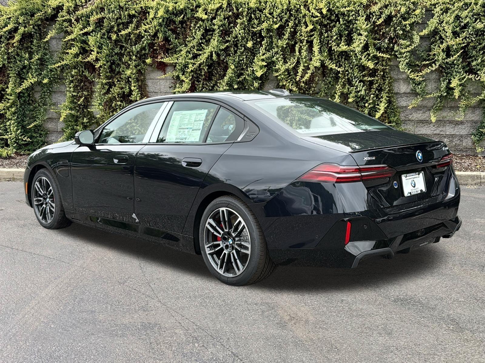 New 2027 Carbon Black Metallic BMW 550e xDrive image 6