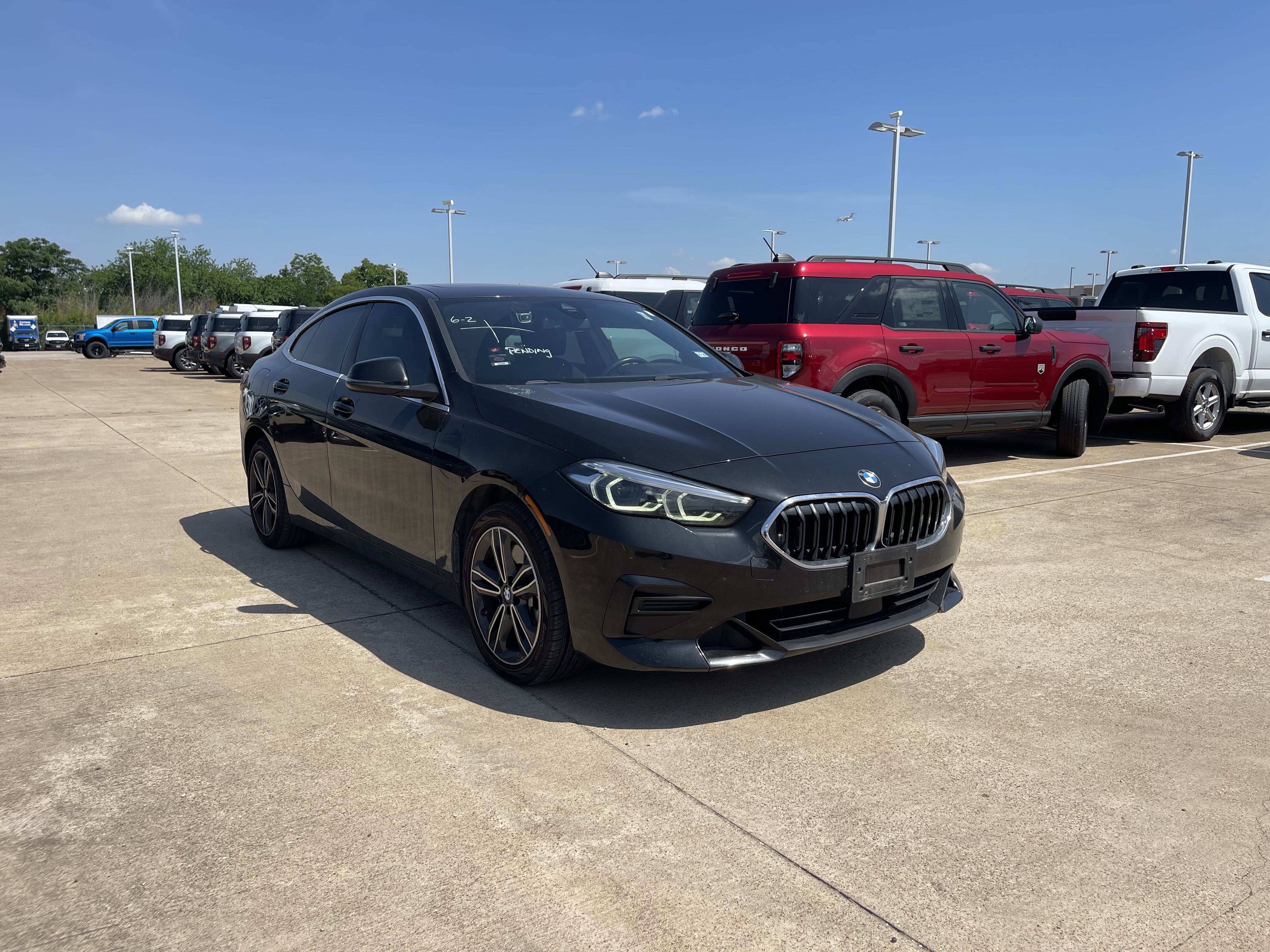 Used 2024 Black Sapphire Metallic BMW 228i xDrive image 2