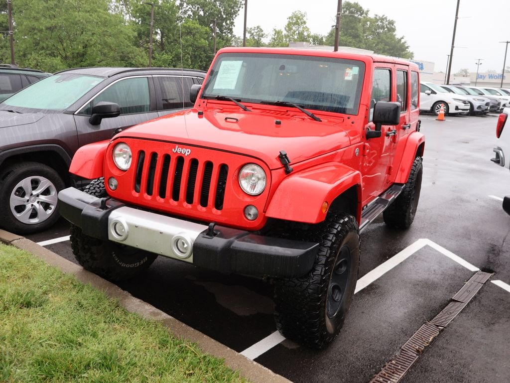 Used 2015 Red Jeep Unlimited Sahara image 3
