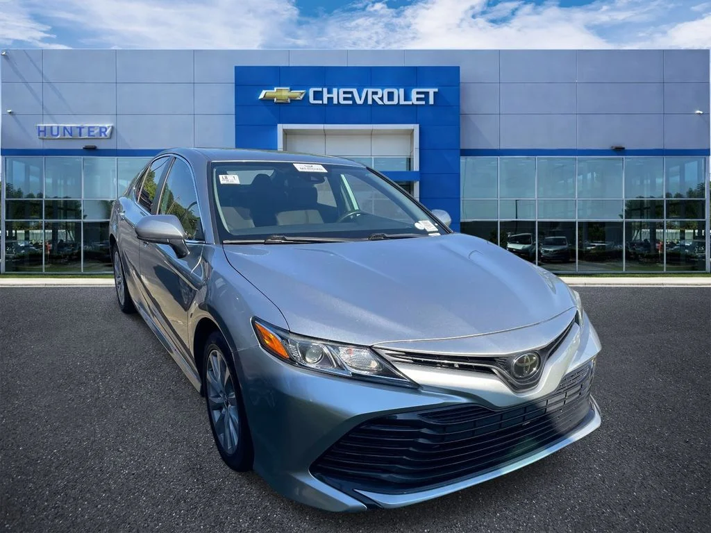 Used 2020 Celestial Silver Metallic Toyota LE image 1