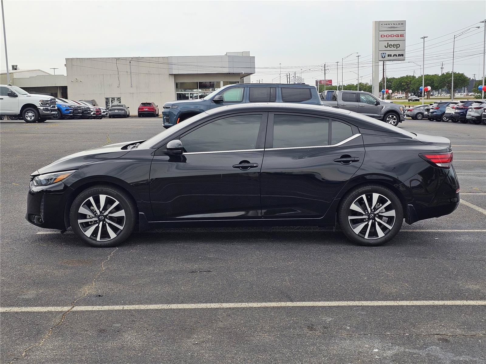 Used 2024 Super Black Nissan SV image 12
