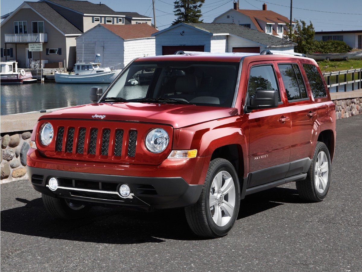 Used 2012 Orange Jeep Latitude image 1