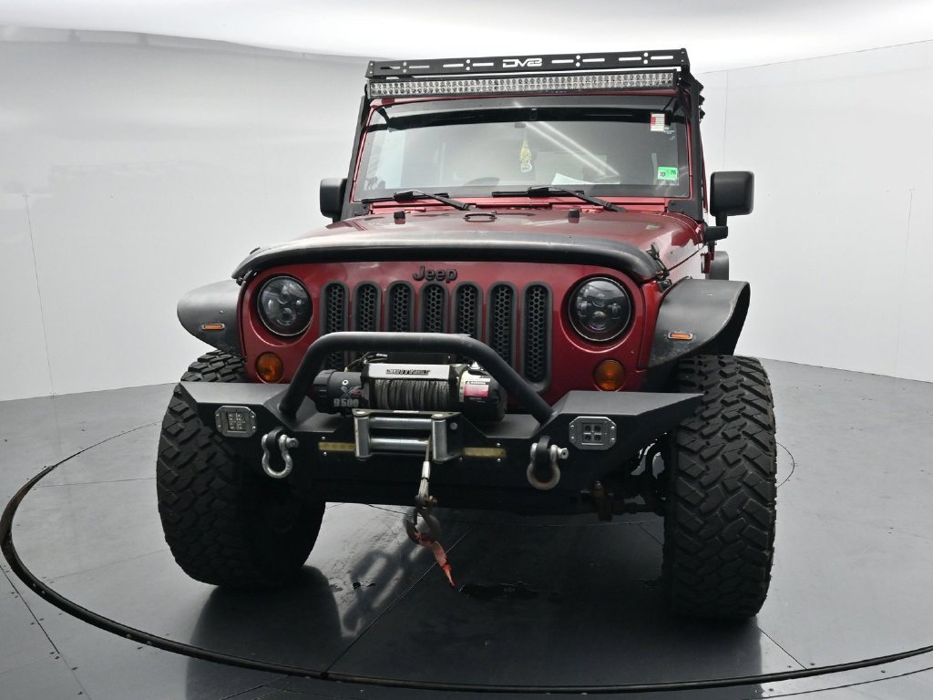 Used 2012 Red Jeep Unlimited Sport image 3