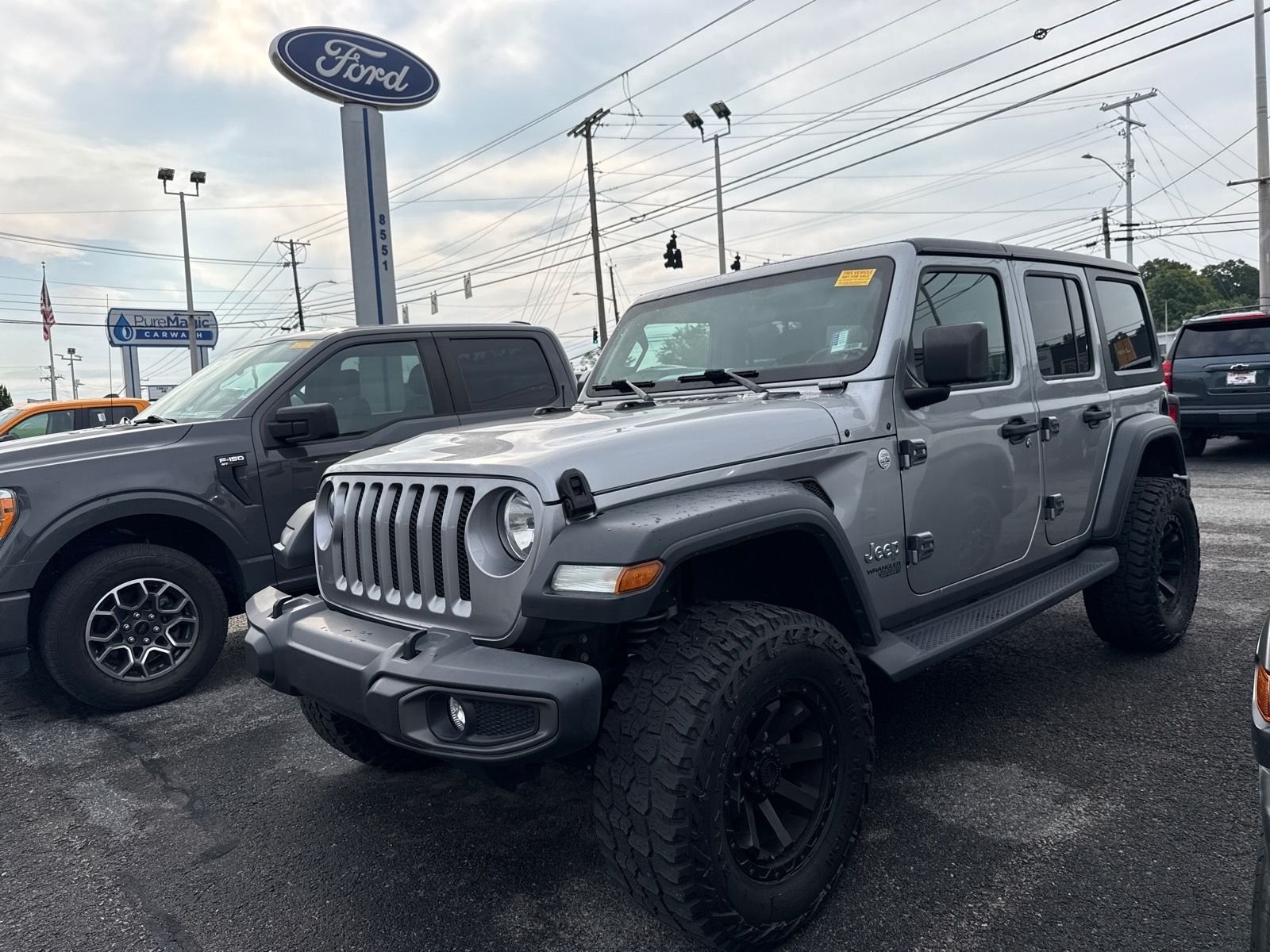 Used 2020 Billet Silver Metallic Jeep Unlimited Sport S image 1