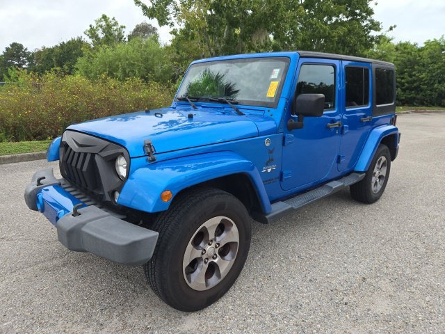 Used 2016 Hydro Blue Pearlcoat Jeep Sahara image 1