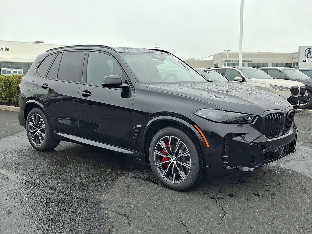 Used 2026 Black Sapphire Metallic BMW xDrive50e image 2