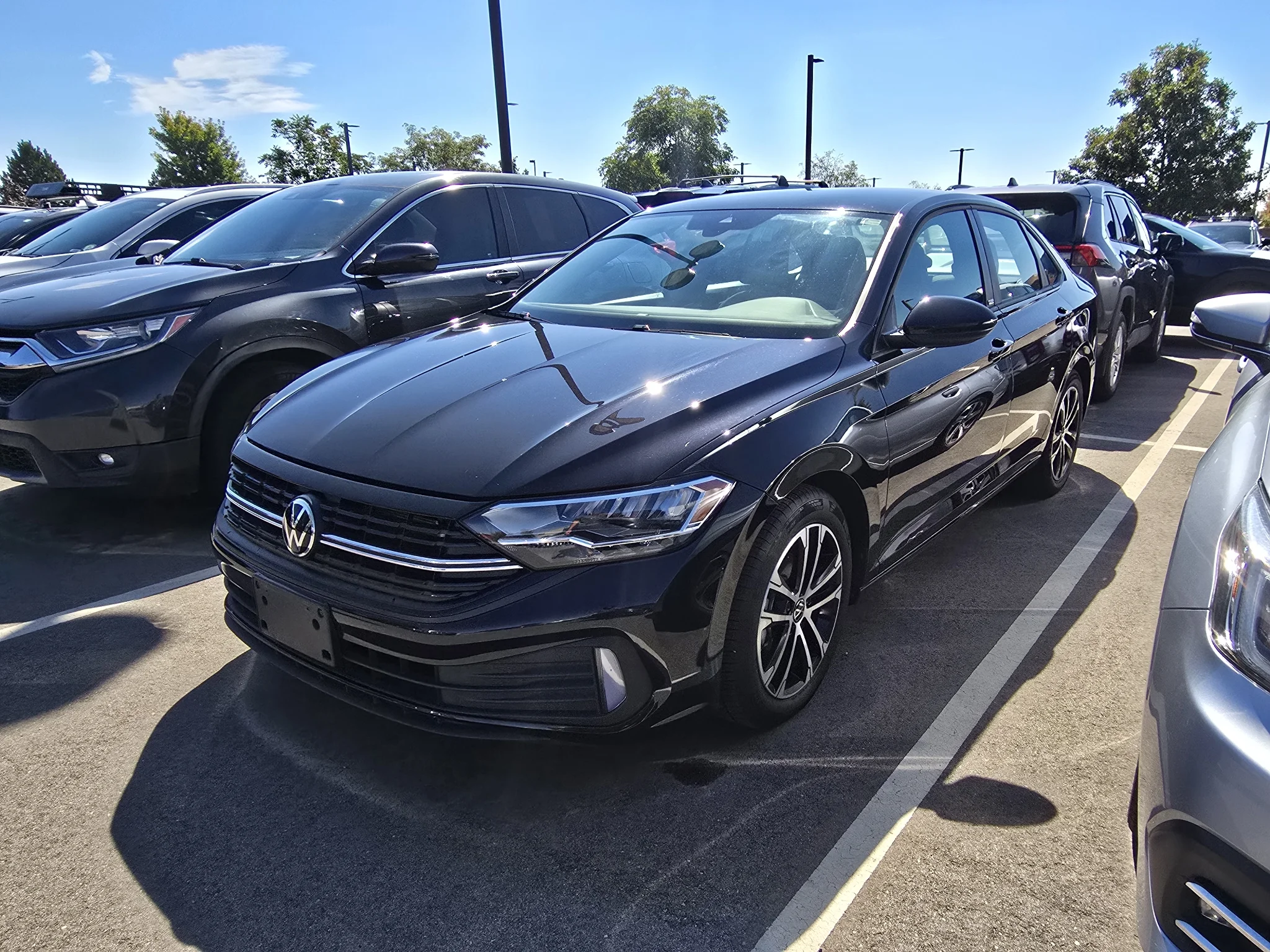 Used 2024 Deep Black Pearl Volkswagen Sport image 1