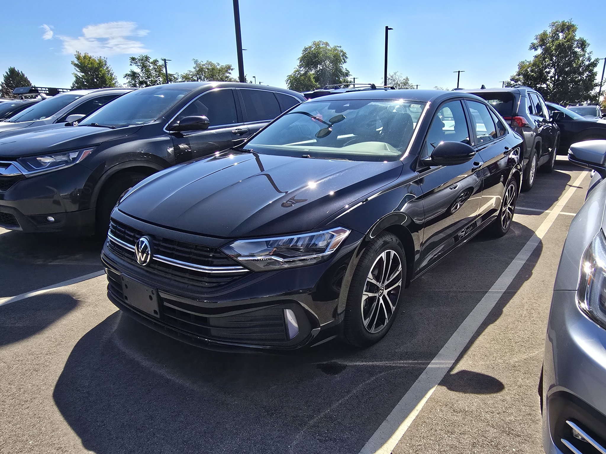 Used 2024 Deep Black Pearl Volkswagen Sport image 1