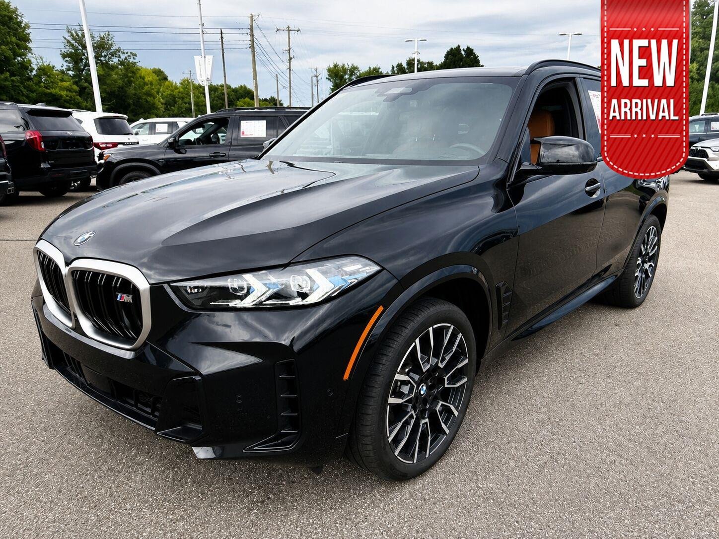 Used 2025 Black Sapphire Metallic BMW M60i image 1