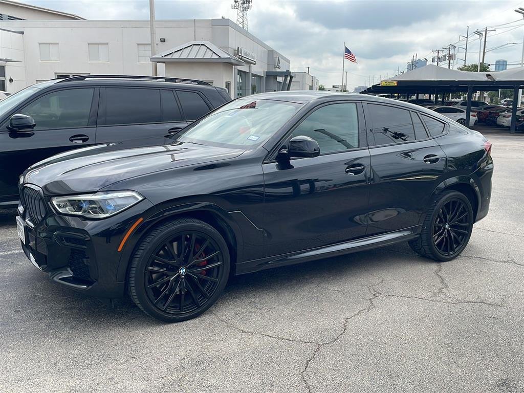 Certified Used 2023 Black Sapphire Metallic BMW M50i image 1