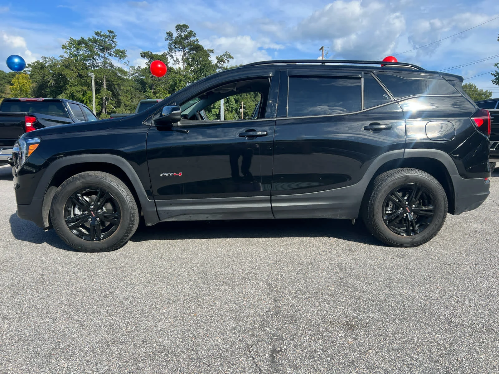 Used 2024 Ebony Twilight Metallic GMC AT4 image 2