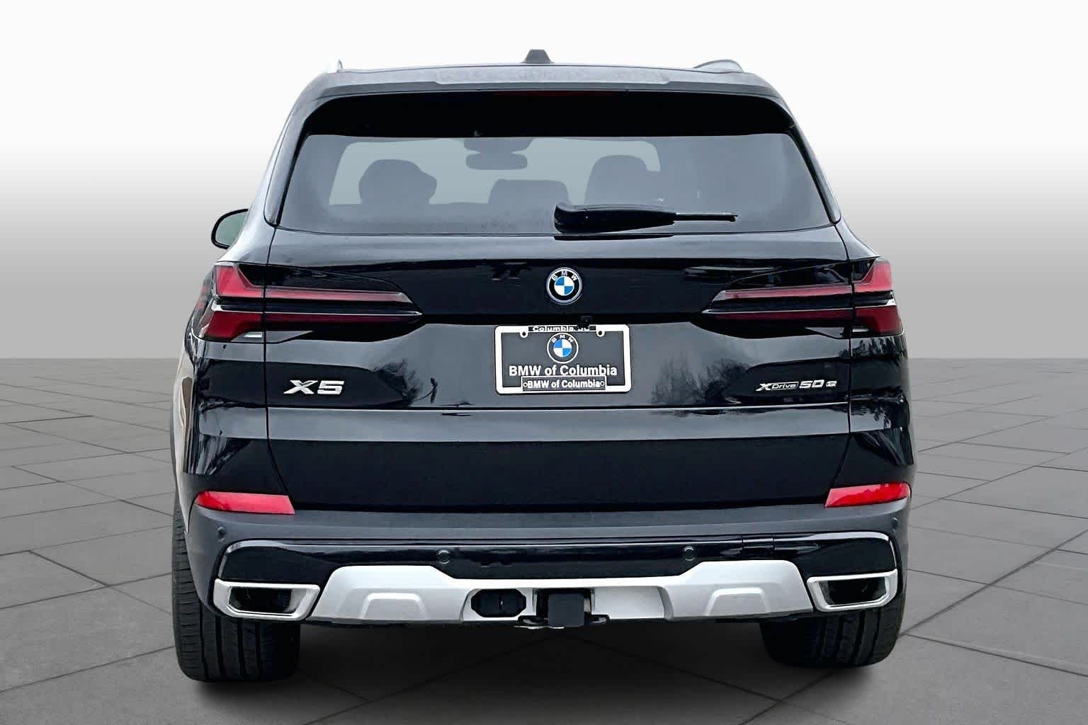 New 2026 Black Sapphire Metallic BMW xDrive50e image 4